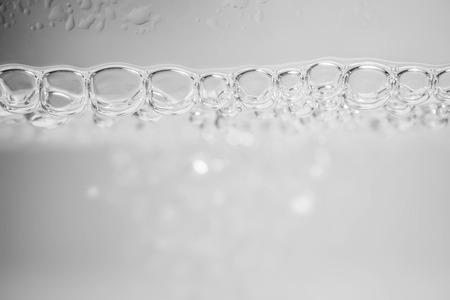 Gray tone of wave and bubblesの写真素材