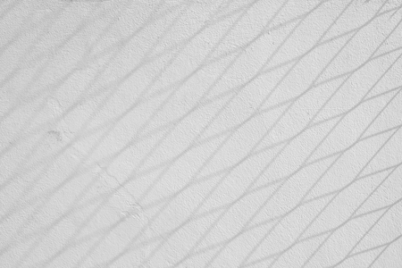 shadow of square on a gray concrete rough texture wallの写真素材