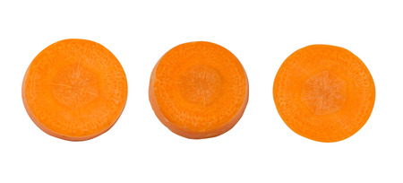 close up top view of fresh three carrot slice isolated on white backgroundの写真素材