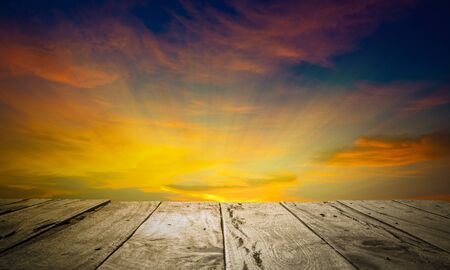 Old brown wooden floor and sky background in evening and beam sunset. Using idea design wallpaper...