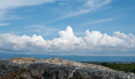 Stone podium on nature background with clouds and copy space use show productの写真素材