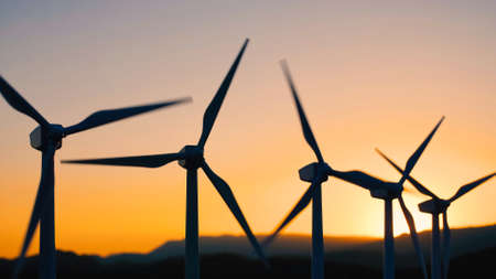 wind turbine with blades turn on nature background with sunset sky, Wind power generators, windmill,...