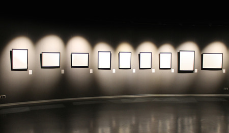 A dark hall in the art gallery template. Black wall with empty frames for photos.