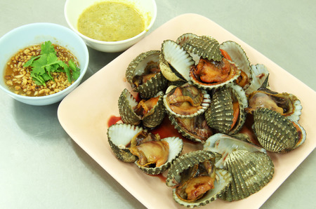 Grilled cockle on the dish is Thai seafood style.