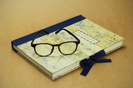 Vintage photo album on a brown paper background