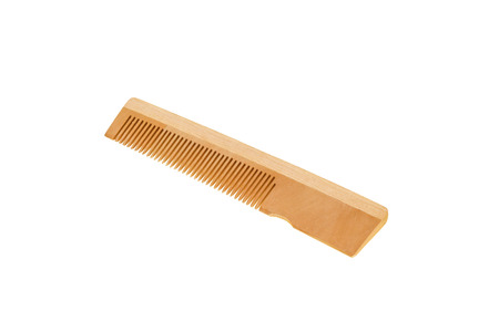 Wooden comb on a white background