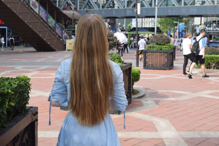 Unidentified people walking in the city center.の写真素材