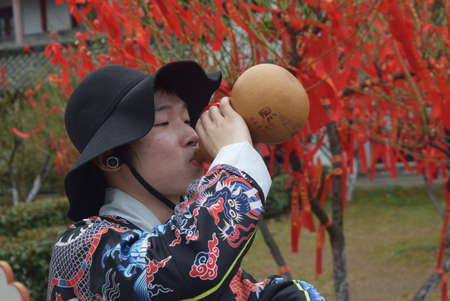 People wearing traditional clothes to celebrate the Lunar New Year.の写真素材