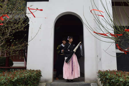 Women in traditional dress at the Wuxi Palace.の写真素材