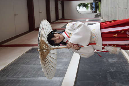 Unidentified Japanese woman in traditional costume performs a traditional dance in Kyoto, Japan.の写真素材
