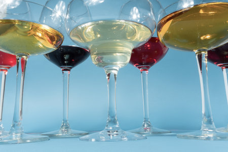 Colored cocktails variety close up on a blue background frontal view.の写真素材