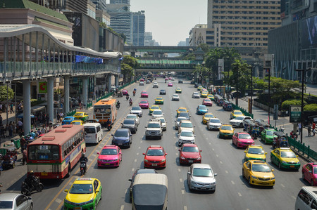 Bangkok, Thailand - February 20, 2017: Colorful taxi cars wait in the traffic in the business district of Bangkok, Thailand, near Central World mall.のeditorial素材