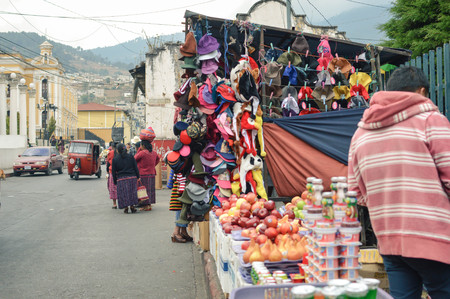 Totonicapan, Guatemala - February 10, 2015: Maya people and cars are seen in the streets of a small colonial town of Totonicapan in Guatemala on a busy market day. Central Americaのeditorial素材