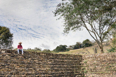 Ocosingo, Mexico - January 9, 2015: Local tour guide takes rest on the steps of one of the pyramids at Tonina archaeological site in Chiapas, Mexico on January 9, 2015のeditorial素材