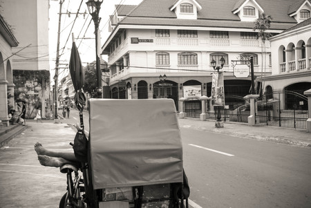 Manila, Philippines - May 3, 2009: Rickshaw driver takes rest while waiting for customers in Intramuros, aka Walled City, in Manila, Philippinesのeditorial素材