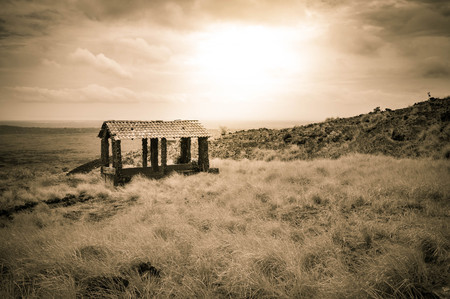 Magic volcanic landscape with a gazebo set on top of the lava field at the foot of Masaya and Nindiri volcanoes in Nicaragua. Sepia filter. Central Americaの写真素材