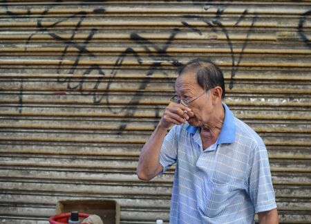 Kuala Lumpur, Malaysia - 10 September, 2017: Chinese street vendor sells food on Jalan Petaling  in Kuala Lumpur, Malaysiaのeditorial素材