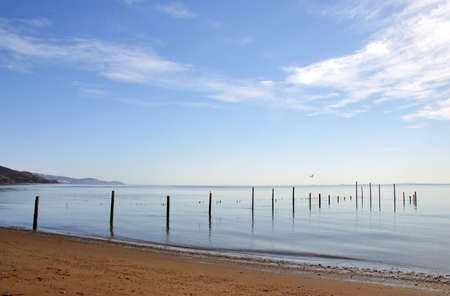 shore landscape with blue and cloudy skyの写真素材