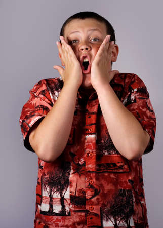boy with hand on his face