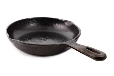 cast iron pan isolated on whiteの写真素材