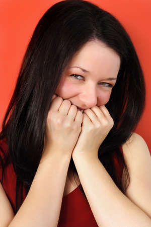 expressive young woman, red background