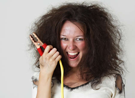 theatrical image of woman with booster cableの写真素材