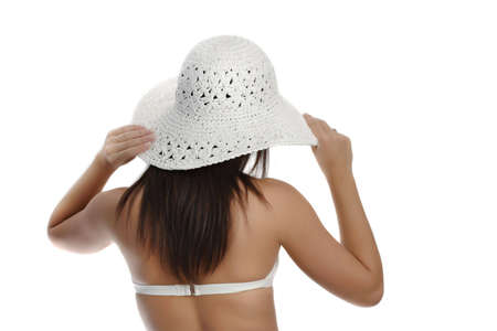 young woman wearing white bikini and hat, isolated on whiteの写真素材