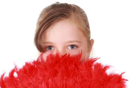 cute little blond girl hiding behind red feathers