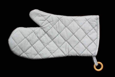single grey oven glove isolated on black backgroundの写真素材