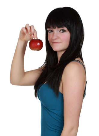 Cute young woman holding a red apple isolated on white backgroundの写真素材