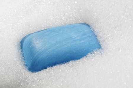 blue soap bar over bubble bathの写真素材