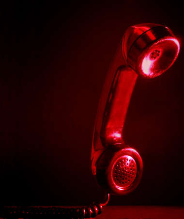 closeup on red phone handset の写真素材