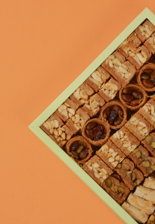crop of a box of many different baklava with pistachio et cashewの写真素材