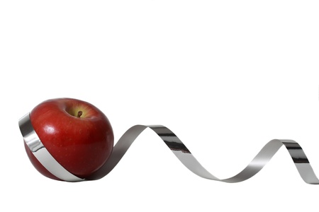 red apple with silver ribbon, isolated on whiteの写真素材