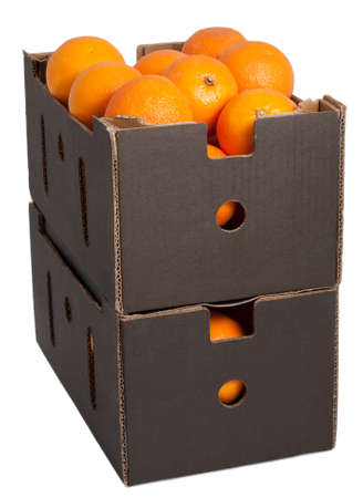 Nice fresh raw oranges in brown box isolated on whiteの写真素材