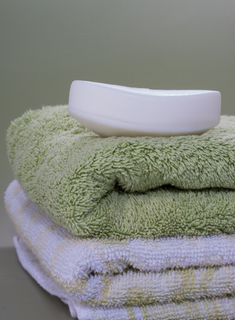 Dry soap bar place over nice bath towelsの写真素材