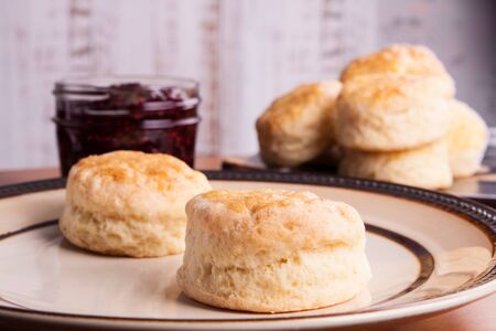 Fresh homemade traditional English scones in a plate ready for the four o'clock tea snackの写真素材