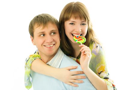 happy couple, young man giving his girlfriend piggyback ride の写真素材