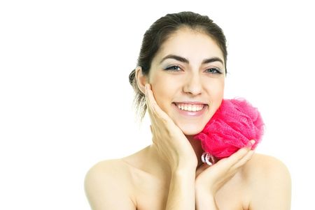 pretty young brunette woman washing her body with a bastの写真素材