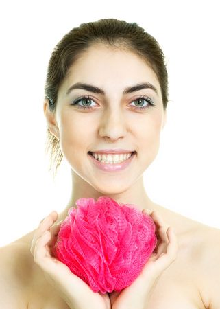 pretty young brunette woman holding a pink bast in her handsの写真素材