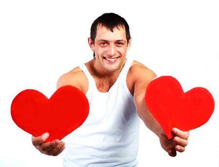 handsome young man with two hearts in his handsの写真素材