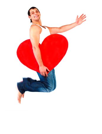 handsome young man jumping high with a heart in his handsの写真素材