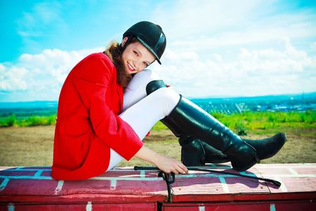portrait of a pretty young woman dressed as an equestrianの写真素材