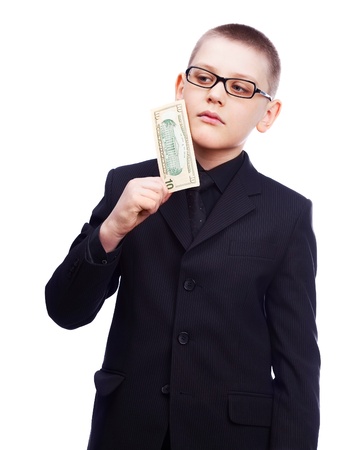 ten year old blond boy wearing a costume with money in his handsの写真素材