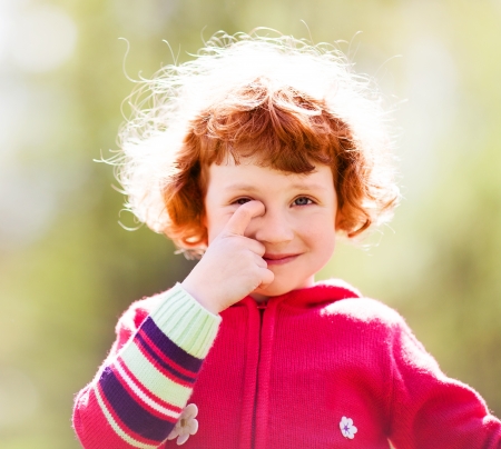 happy five year old girl outdoor on a summer dayの写真素材