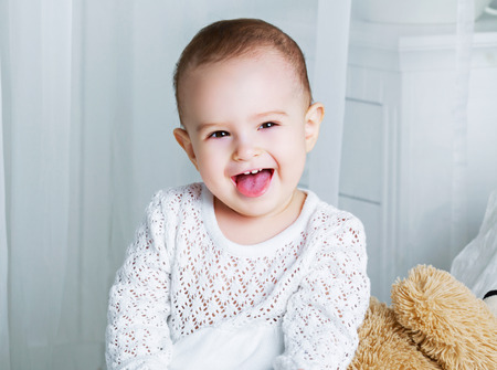 one year old baby in bed at home