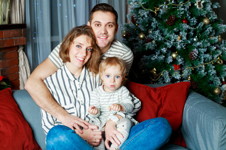 happy family with a child at home at Christmas time
