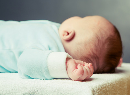 sleeping baby, focus on the handの写真素材