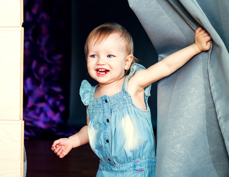 happy smiling baby in the interiorの写真素材