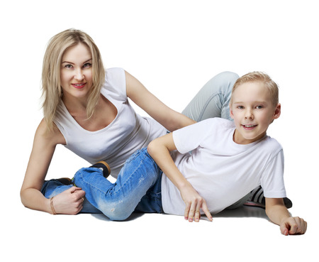 happy smiling mother and son, isolated against white backgroundの写真素材